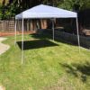A tent is set up in the yard.