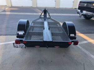 A trailer that has two tires on it.