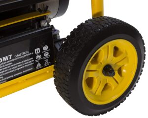 A close up of the wheel on a yellow and black cart