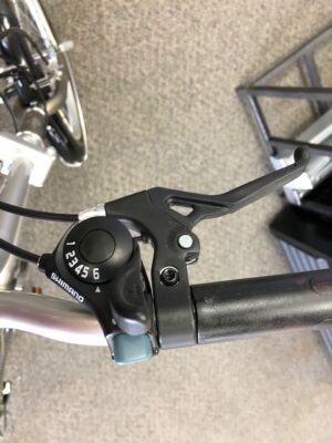 A close up of the handlebar and brake lever