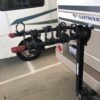 A bike rack in front of a recreational vehicle.