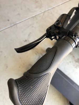 A close up of a handlebar grip on an Add Two Electric Cycleboard.