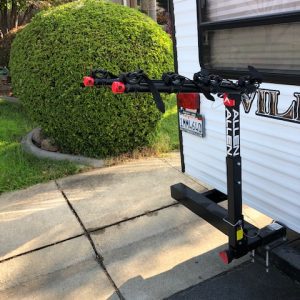 An rv with an Allen Sports 4-Bike Hitch Rack for 2 in. Hitch Deluxe Locking attached to it.