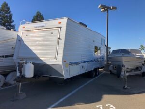 A white trailer parked in the parking lot.