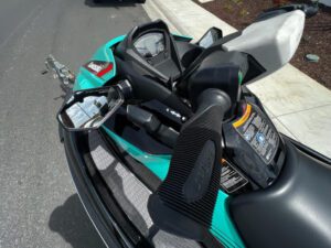 A close up of the dashboard and steering wheel on a motorcycle.