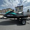 A jet ski is parked on the street.