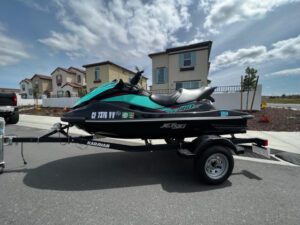 A jet ski is parked on the street.