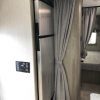 The interior of a 2021 Coachmen Freelander 30' Class C with a refrigerator and sink.