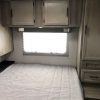 A 2021 Coachmen Freelander 30' Class C with a bed in it.