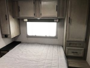 A 2021 Coachmen Freelander 30' Class C with a bed in it.