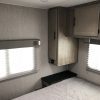 A 2021 Coachmen Freelander 30' Class C with a bed and a window.