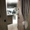 The interior of a 2021 Coachmen Freelander 30' Class C with a kitchen and living room.