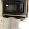 A 2021 Coachmen Freelander 30' Class C is in the kitchen of a small rv.