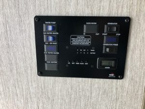 The control panel on the wall of a 2021 Coachmen Freelander 30' Class C.