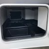 The inside of a 2021 Coachmen Freelander 30' Class C with the door open.