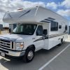 A 2021 Coachmen Freelander 30' Class C parked in a parking lot.