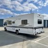 A 2021 Coachmen Freelander 30' Class C parked in a parking lot.