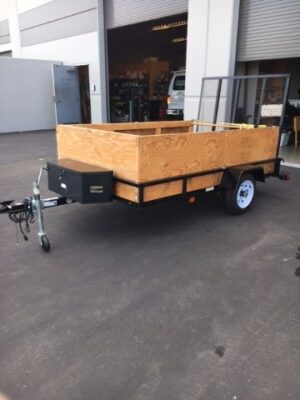 A trailer with a wooden box on it