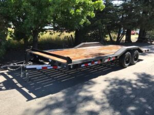 A trailer that has been pulled down by the side of the road.