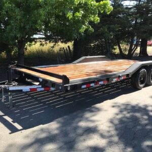 A trailer that has been pulled down by the side of the road.