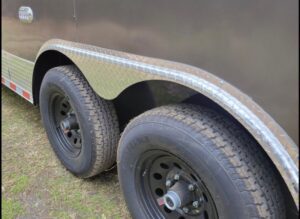 A close up of the tire on a trailer.