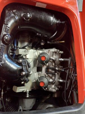 A close up of the engine compartment of an automobile.