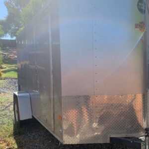 A trailer with the door open and the side of it.
