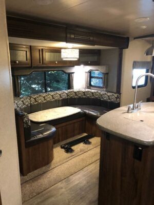 A kitchen with a sink and counter in it