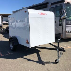 A white trailer parked in the parking lot.