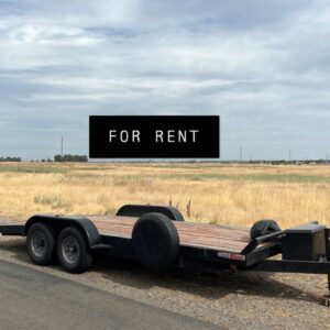 A trailer is parked on the side of the road.