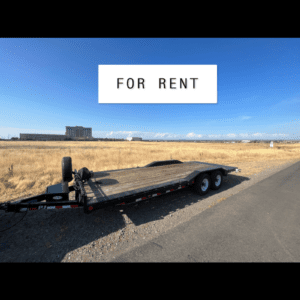 A trailer is parked on the side of the road.